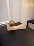 Curved Travertine With Brass Sphere